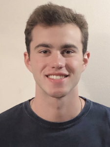 A man smiles.